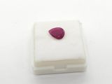 a picture of a piece of white soap with a red tear on it
