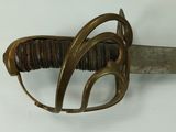 a close up of a sword with a metal handle