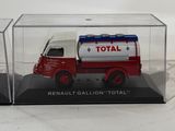 a red and white truck in a clear case