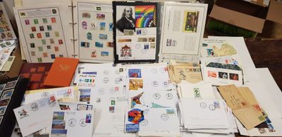 a lot of stamps and postcards on the table