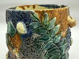 a close up of a cup with a bird on it