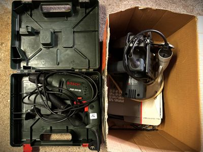 a box with a corded drill in it and a box with a corded drill in it