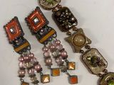 a lot of bracelets that are sitting on a table