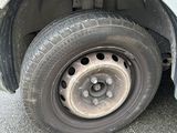 a close up of a flat tire on a car