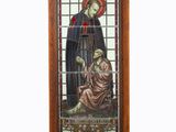 stained glass window with a picture of a man and a woman