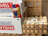 several boxes of canned food are stacked on pallets in a warehouse