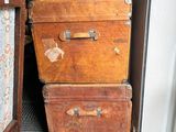two suitcases stacked on top of each other in a room
