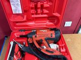 an image of a red tool case with a stapler and stapler in it