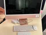 a computer on a desk with a keyboard and mouse