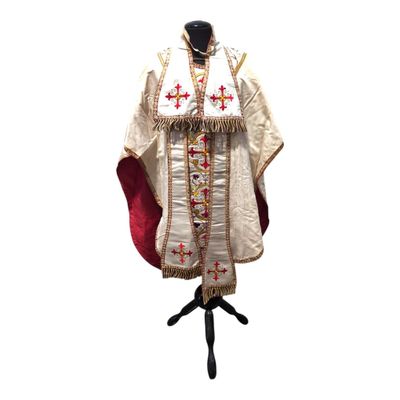 a close up of a priest ' s robe on a mannequin stand