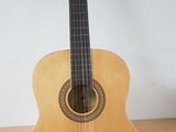 a guitar that is sitting on a stand on the floor