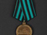 a close up of a medal on a black surface