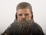 a statue of a man with a beard and a beard