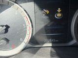 a close up of a car dashboard with a speedometer