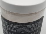 an image of a jar of white powder on a white surface