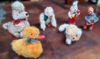 a bunch of stuffed animals that are sitting on a table
