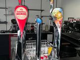bottles of beer are lined up on a counter in a restaurant