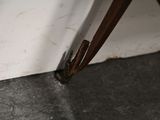 a close up of a broken door handle on a chair