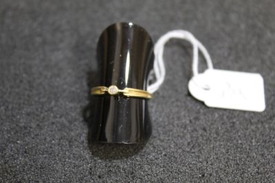 a ring that is sitting on top of a black object
