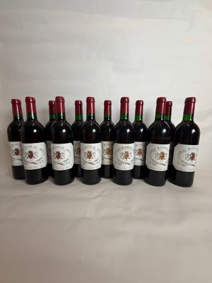 six bottles of red wine lined up in a row
