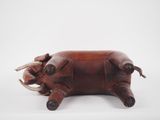 an image of a brown leather pig purse on a white background