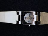 a watch that is sitting on a black surface