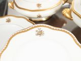 three plates and a bowl sitting on a table