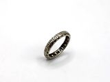 a close up of a ring on a white surface