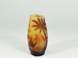 a glass vase with a picture of a boat and palm trees