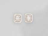 a pair of diamond and white gold earrings