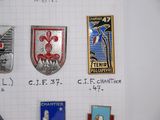 a lot of badges that are on a piece of paper
