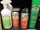 bottles of cleaning products are sitting on a shelf in a store
