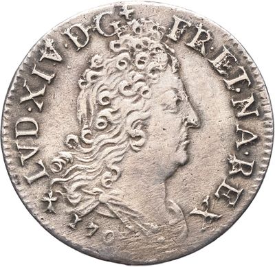 une pièce d'argent portant une tête de femme et une couronne