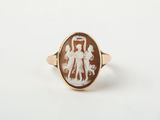 une image représentant une bague sur laquelle figurent les silhouettes d'un homme et d'une femme