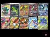 a lot of pokemon cards that are on the table