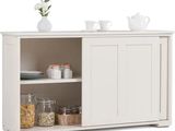 the sideboard is white and has a shelf with dishes and cups on it