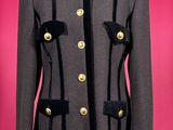 black and grey jacket with gold buttons on a mannequin mannequin mannequin mannequin mannequin mannequin mannequin manne