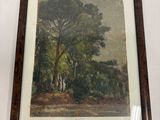 tableau représentant un paysage boisé avec des arbres, dans un cadre en bois
