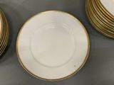 a lot of plates that are sitting on a table