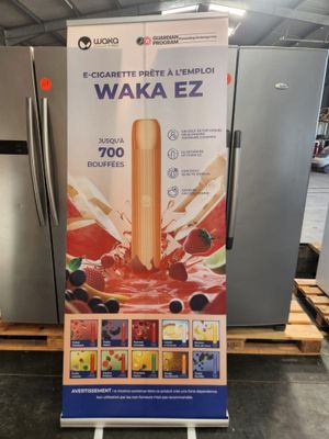 a sign that says waka ez on it in front of a refrigerator