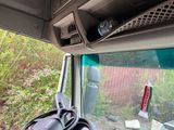 a view of the inside of a bus from the driver ' s seat