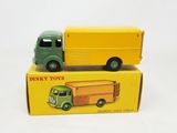 a green and yellow toy truck and a yellow toy truck