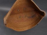 a brown hat that is sitting on a table