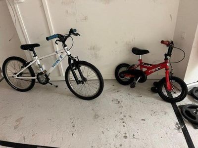 two bikes parked next to each other in a room