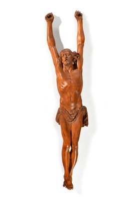 an image of a wooden statue of jesus hanging on a wall