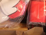a cardboard box filled with a red and white mickey mouse