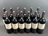 six bottles of red wine are lined up in a row