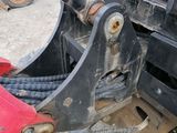 a close up of a red and black vehicle with a red handle