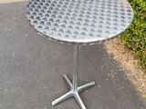 an image of a round table with a metal base