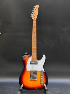 an electric guitar sitting on top of a metal stand